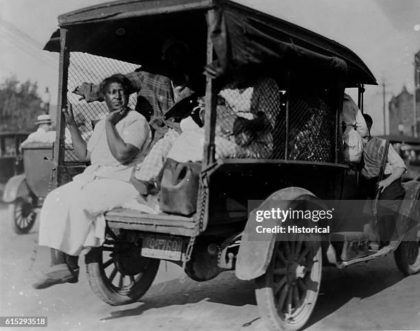 African Americans detained during the Tulsa Race Massacre in Tulsa, Oklahoma, US, June 1921; an African-American woman sits in the back of a truck,...