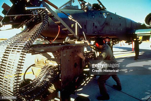 Ordnance personnel load a 30mm cannon on an A-10 Thunderbolt II aircraft during combined Army-Air Force live fire exercises at the Yukon Command...