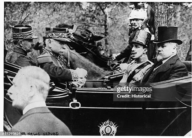 King Alfonse of Spain sits in a carriage with Raymond Poincare, the Prime Minister of France. | Location: Madrid, Spain.