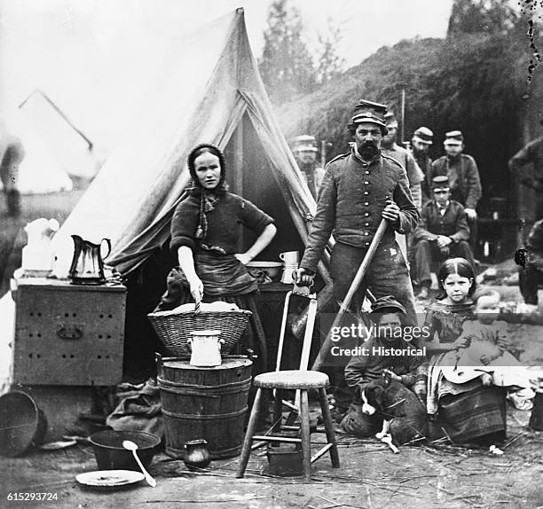 The family of a Civil War soldier, in the camp of the 31st Pennsylvania Infantry.