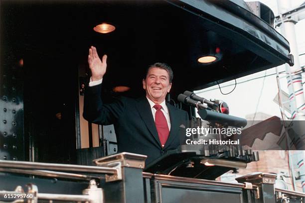 Ronald Reagan waves to supporters as he speaks from aboard the Ferdinand Magellan Train during his 1984 presidential election campaign.