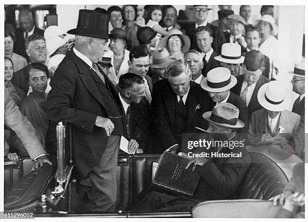 President Franklin D. Roosevelt receiving a book entitled President Franklin D. Roosevelt from the works of The Man From Puerto Rico, James M. Curley.