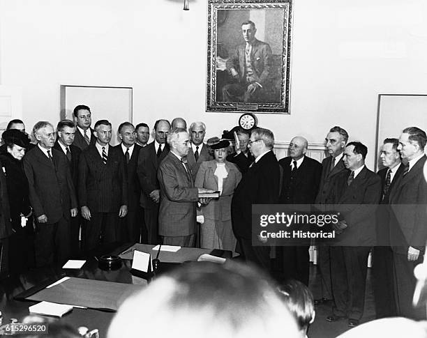 Harry Truman takes the Presidential Oath of Office following the death of Franklin D. Roosevelt on April 12, 1945. The Oath is being administered by...