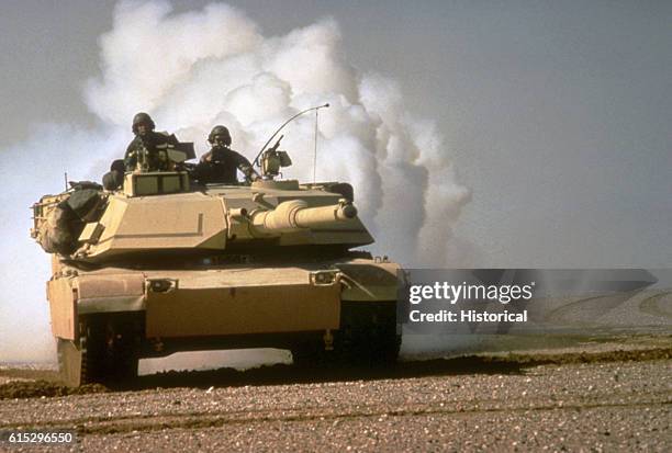 An M-1A1 Abrams main battle tank lays a smoke screen during maneuvers in Saudi Arabia during Operation Desert Storm. January