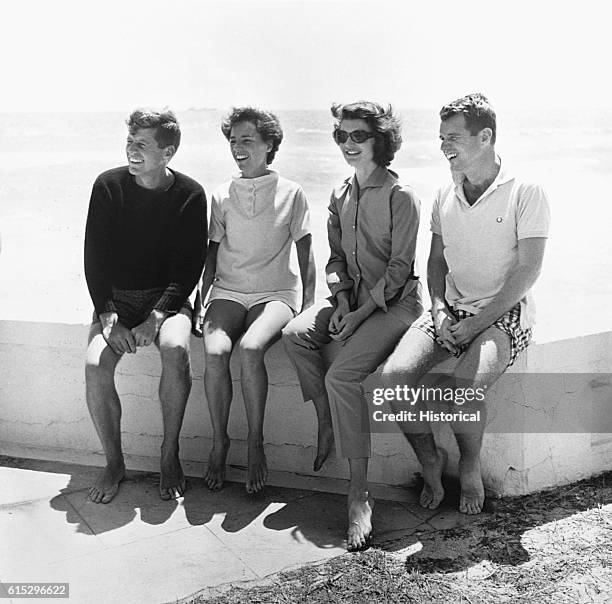 John F. Kennedy, Ethel Kennedy, Jacqueline Kennedy, and Robert Kennedy at the beach.