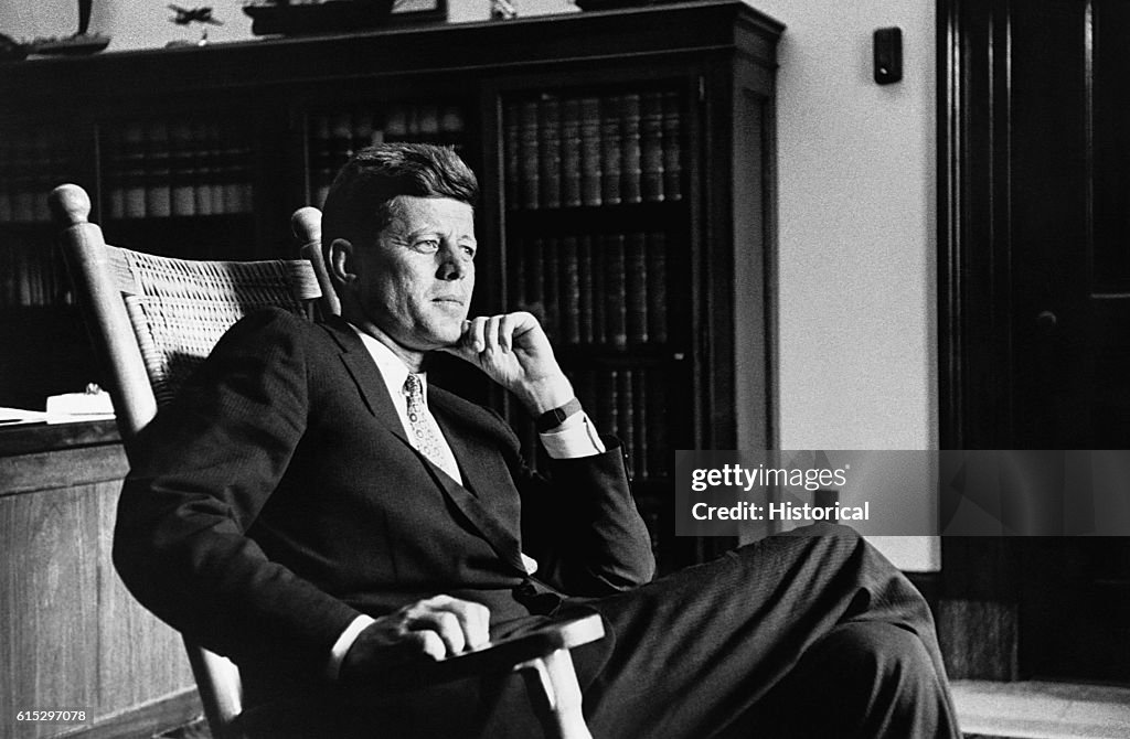 John F. Kennedy Seated in rocking Chair