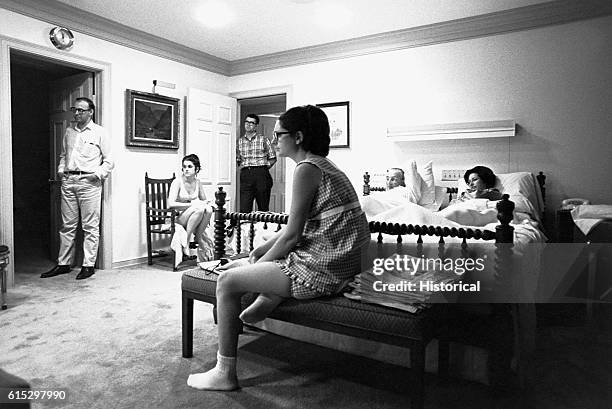 President Lyndon B. Johnson and his family watch television reports of the violence in Chicago during the Democratic National Convention, in which...