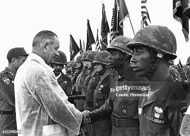 President Lyndon B. Johnson meets soldiers stationed at Fort Campbell, Kentucky, on a visit in July 1966.