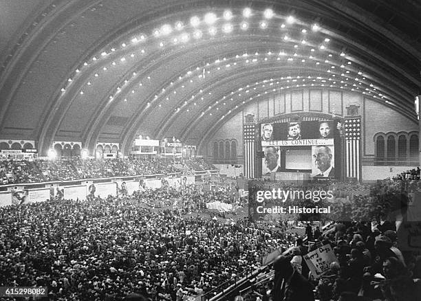 Delegates to the Democratic National Convention in Atlantic City, New Jersey in 1964 pack the floor of the convention center as President Lyndon B....