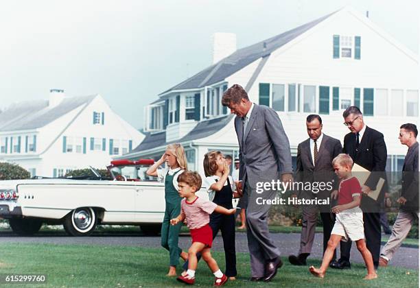 President John F. Kennedy with his children, John Jr. And Caroline, and their cousins, on the way to a candy store in Hyannis Port.