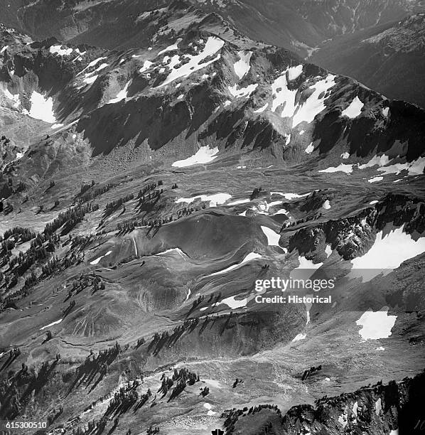 Hilly, exposed area composed of cinders from previous volcanic activity is visible on the side of Glacier Peak in the North Cascades. Washington,...