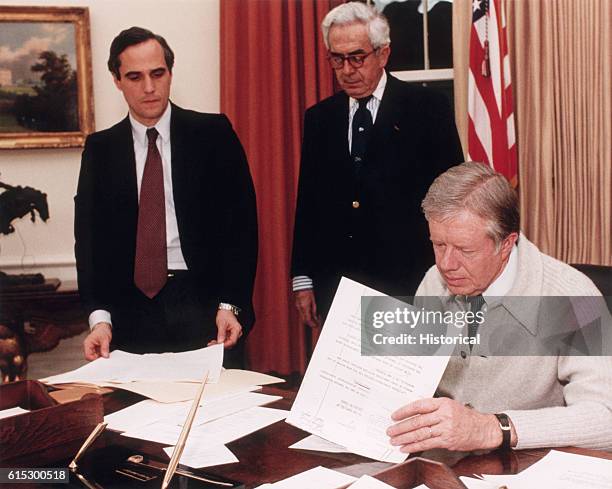 President Jimmy Carter Signs a Document Demanding the Release of Americans Held Hostage in Teheran, Iran