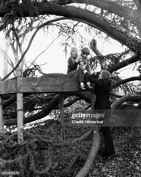 President Carter, his daughter Amy, and his grandson Jason James at Amy's treehouse in Camp David, Maryland. Ca. 1978.