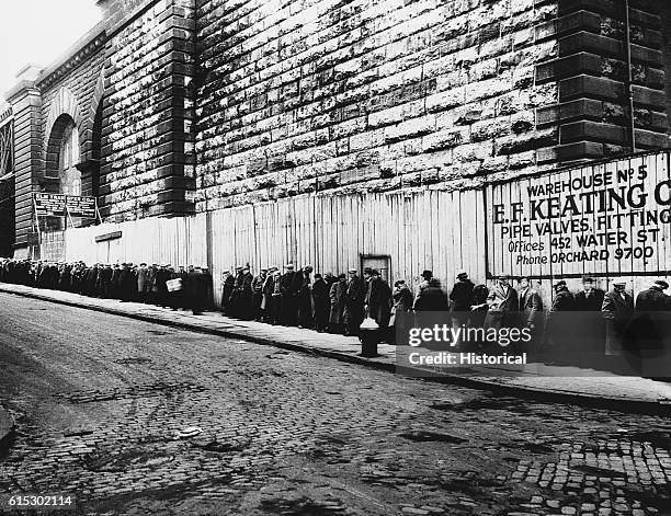 Long bread line near the Brooklyn bridge during the Great Depression. New York, New York, ca. 1930-1935.