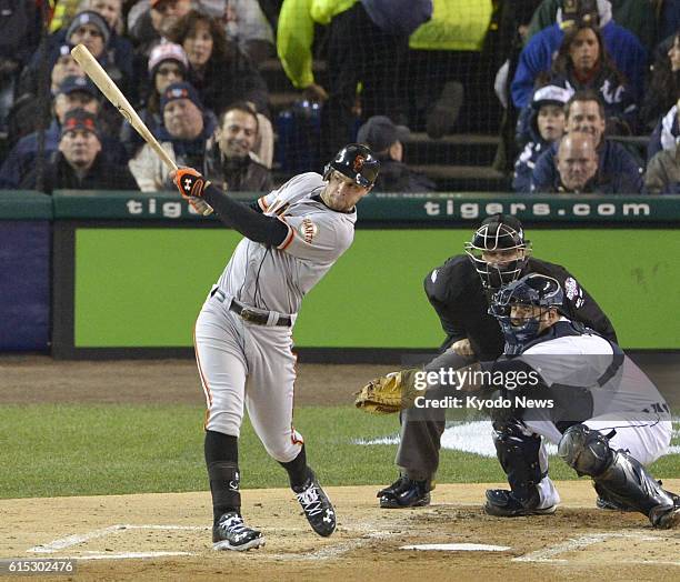 United States - San Francisco Giants first baseman Brandon Belt hits an RBI triple in the second inning of Game 4 of the major league World Series...