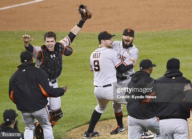 United States - Members of the San Francisco Giants celebrate after winning Game 4 of the major league World Series against the Detroit Tigers at...