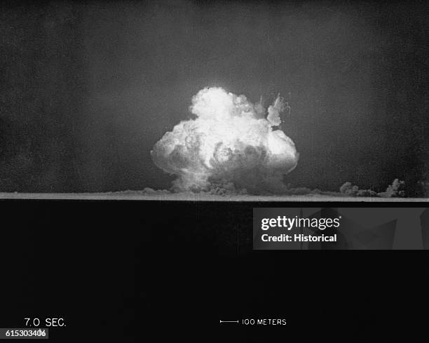 This photo taken at seven seconds after Gadget's detonation at 5:29:45 a.m. Shows the tremendous fireball erupting in the early morning sky, proving...
