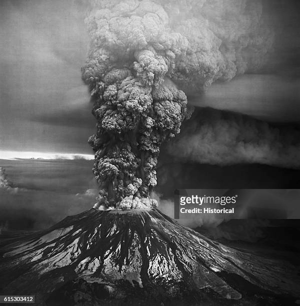 Mount Saint Helens in the southern Washington Cascades erupts violently on May 18, 1980. This view from the south shows both aspects of the eruption:...