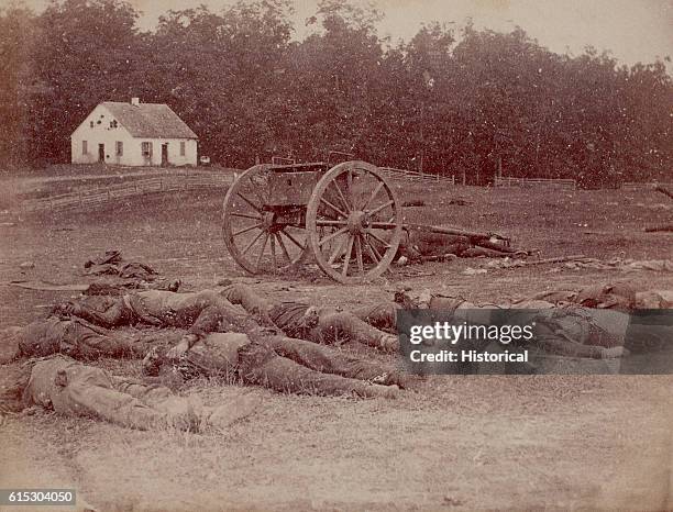 Several dead Confederate artillerymen lie outside Dunker Church after the Battle of Antietam. The church was the location of some of the bloodiest...