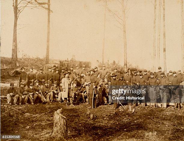 Officers and men of the 1st United States Cavalry pose after the Battle of Five Forks. General George Armstrong Custer stands at front . | Location:...