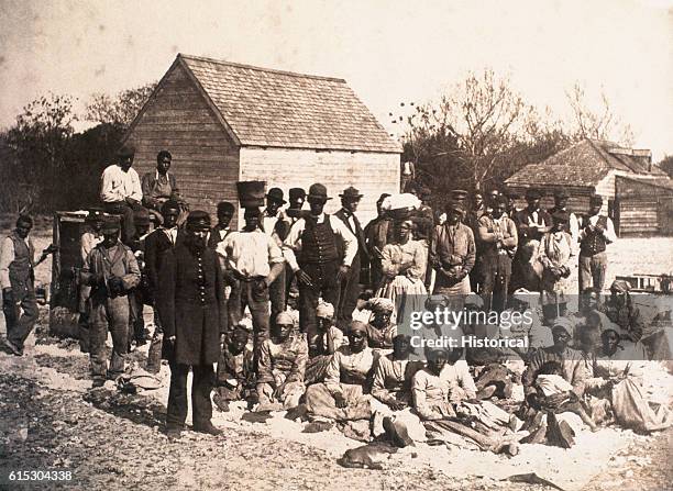 Group of freed slaves gather on the plantation of Confederate general Thomas F. Drayton in Hilton Head, South Carolina, during the Union occupation...