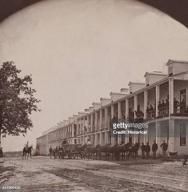 Union soldiers pose at a barracks building at Fort Leavenworth, Kansas, ca. 1865. | Location: Fort Leavenworth, Kansas, USA.