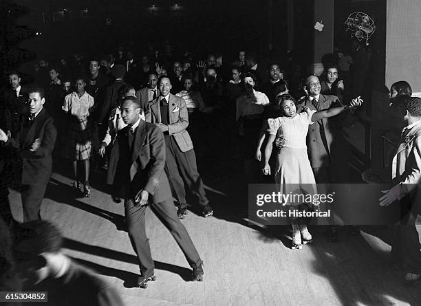 African American roller skaters pack a rink on a Saturday night in Chicago.