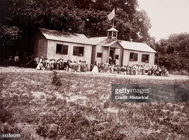 Students and teachers pose outside the Freedmen's Bureau school in Beaufort, South Carolina.