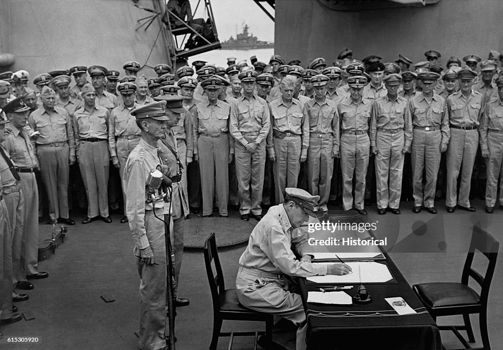 General MacArthur Signs During Japanese Surrender Ceremony