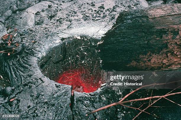 The stump of a charred tree left behind a lava tube molded in its shape. Hawaii. | Location: Kupaianaha, Hawaii, USA.