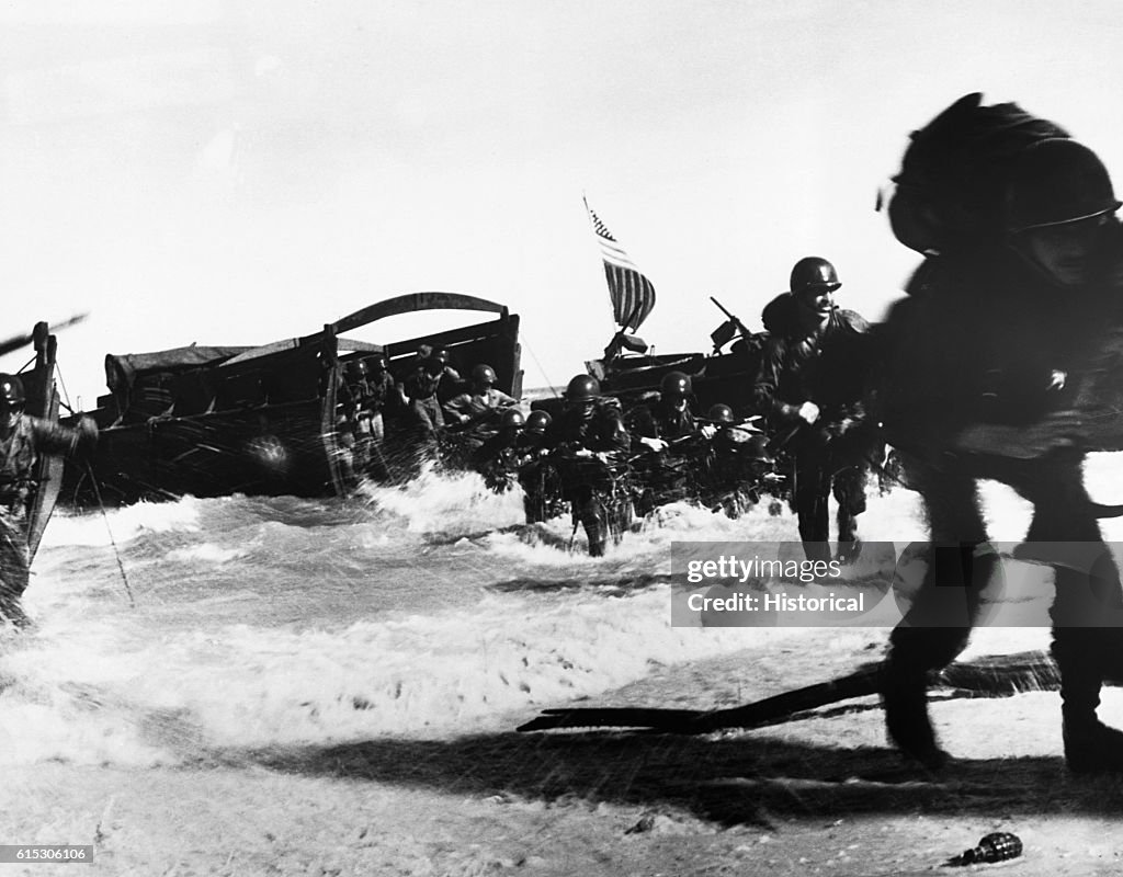 American troops of the 163rd Infantry Regiment hit the beach from Higgins boats during the invasion of Wadke Island, Dut