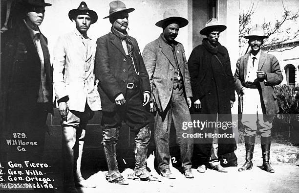 General Francisco "Pancho" Villa, Mexican revolutionary leader, stands with other Mexican revolutionary figures. R to l: Colonel Medina, General...