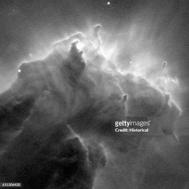 Close-up of large formations of molecular hydrogen and interstellar dust in the shape of pillars. Ultraviolet light from nearby stars has eroded away...