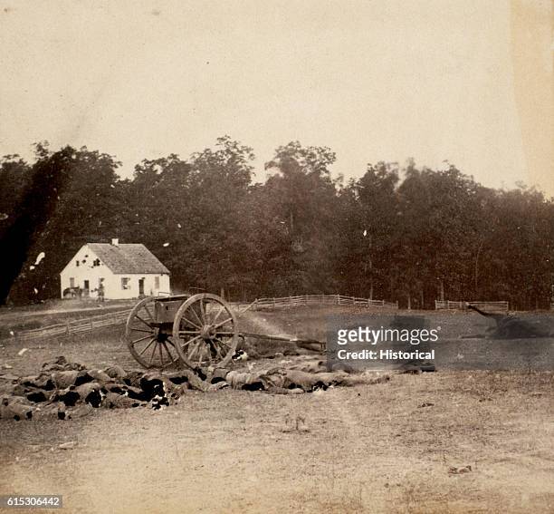 Several dead Confederate artillerymen lie outside Dunker Church after the Battle of Antietam. The church was the location of some of the bloodiest...