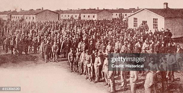 Confederate prisoners of war stand outside their barracks at Camp Douglas in Chicago, Illinois.