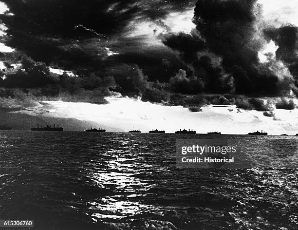 Bullets flicker against dark clouds in the sky as an air battle rages above American ships off Leyte Island. The attack on this part of the...