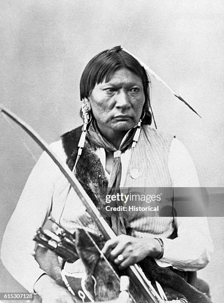 Portrait of Penateka Comanche Milky Way, also known as Asa Havi or Bird Chief; half-length, seated, holding bow, 1872. | Location: in a studio.