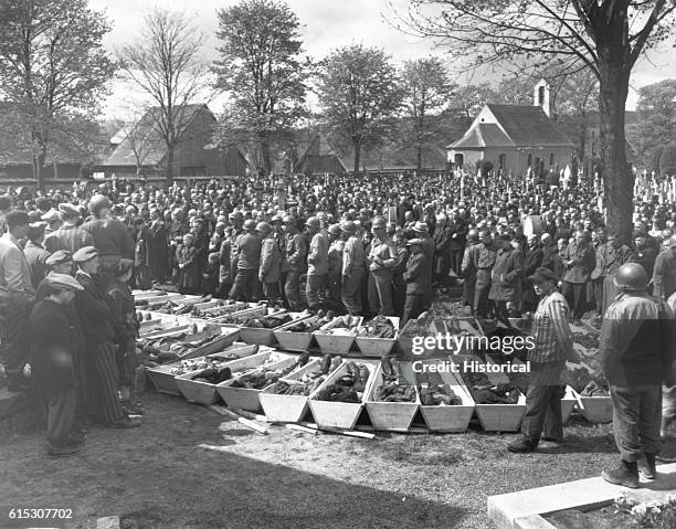 Chaplains of the U.S. Third Army conduct burial services for the 120 Russian and Polish Jews, victims of SS troopers in a wood near Neunburg,...