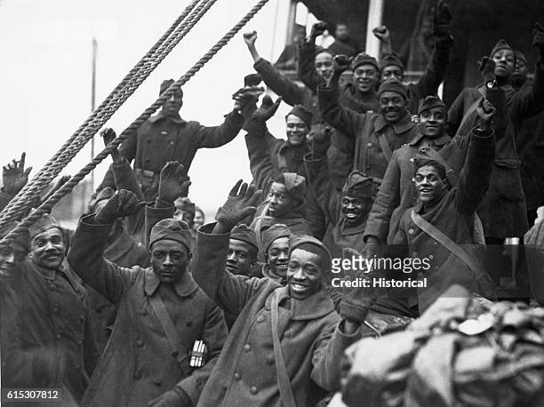 Members of the famous 369th Colored Infantry, formerly 15th N.Y. Regulars, arrive in New York City. "Back to little old New York." 1919.
