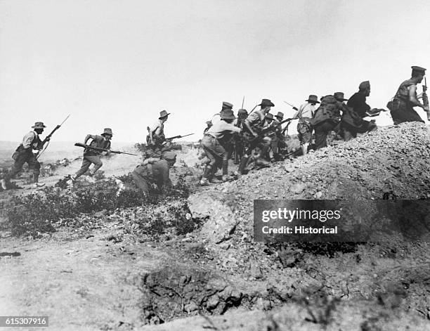 Australian troops charge near a Turkish trench just before the evacuation at Anzac. When they got there the Turks had flown. Dardanelles Campaign,...