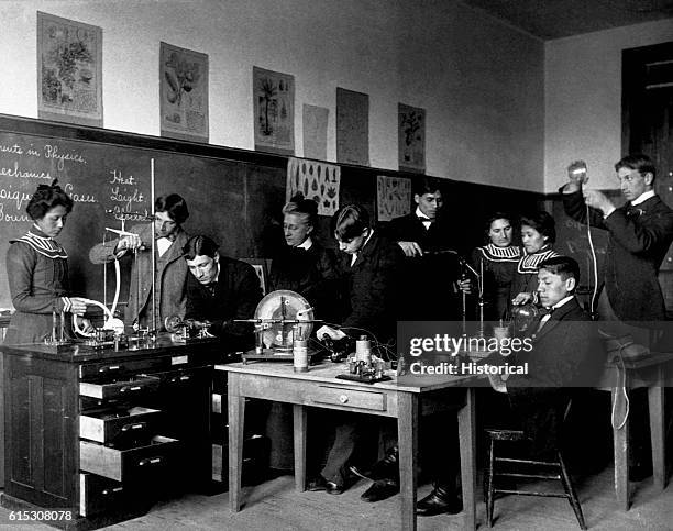Native American students conduct physics experiments at the Carlisle Indian School in Pennsylania. Ca. 1915.