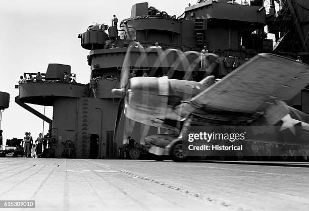 Grumman F6F Hellcat taxies for takeoff from the USS Lexington aircraft carrier. November 1943.