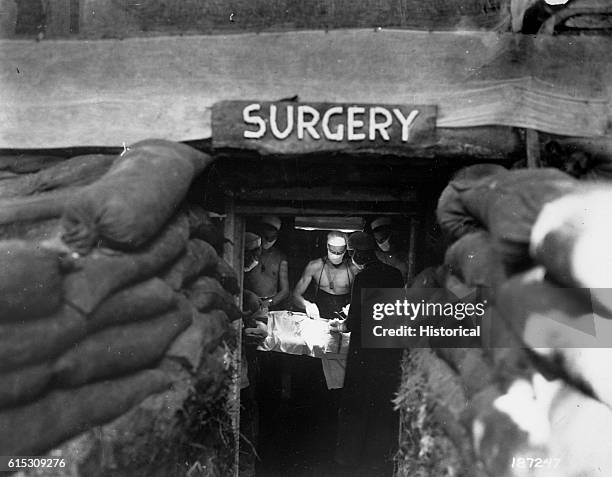 Sandbags form a protective barrier around the entrance of a dugout surgery room near the Allied front lines at Bougainville in the Solomon Islands....