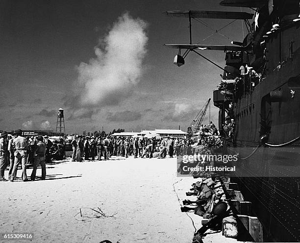 Marines disembark from USS Pensacola at Midway Island. | Location: Midway Island, Central Pacific.