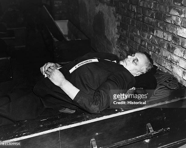 Nazi, Alfred Rosenberg, lies dead on a casket following his execution after the Nuremberg Trials. The Nuremberg Trials ended on October 1, 1946.