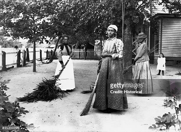 Women using brooms made of bambusa, on Latimer's place, Belton, South Carolina. September 29, 1899. | Location: Belton, South Carolina, USA.