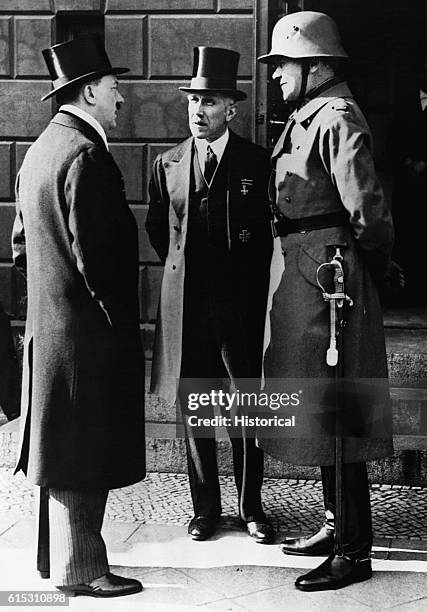 Franz von Papen, German politician , with Adolf Hitler and von Blomberg on a day of general mourning for German soldiers killed in World War I.