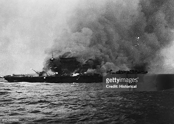 Burning of USS Lexington following Battle of Coral Sea, May 8, 1942.