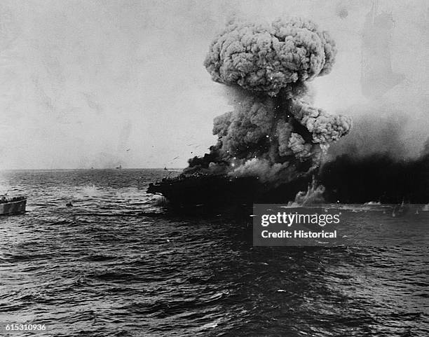 Burning of USS Lexington following the Battle of the Coral Sea, May 8, 1942.