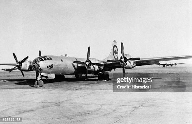 The Enola Gay, the B-29 bomber which dropped the first atomic bomb on Japan, stands on the runway at Tinian following the raid. August 1945.